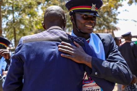 A recruit shares a moment with  family after graduating